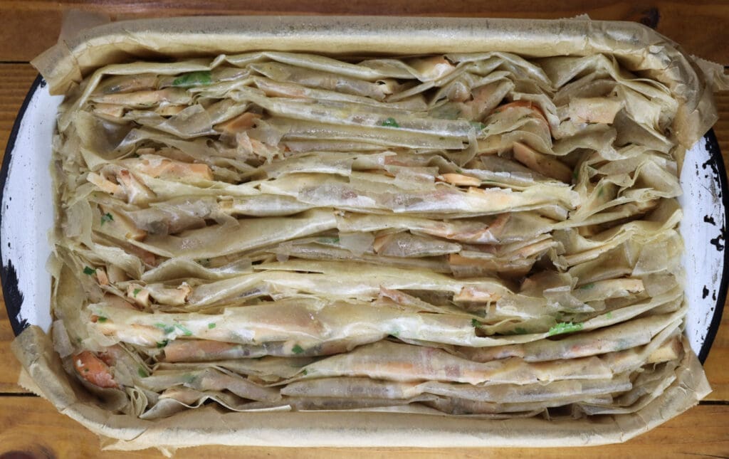 Phyllo dough for chicken of the woods pie in the pan before baking